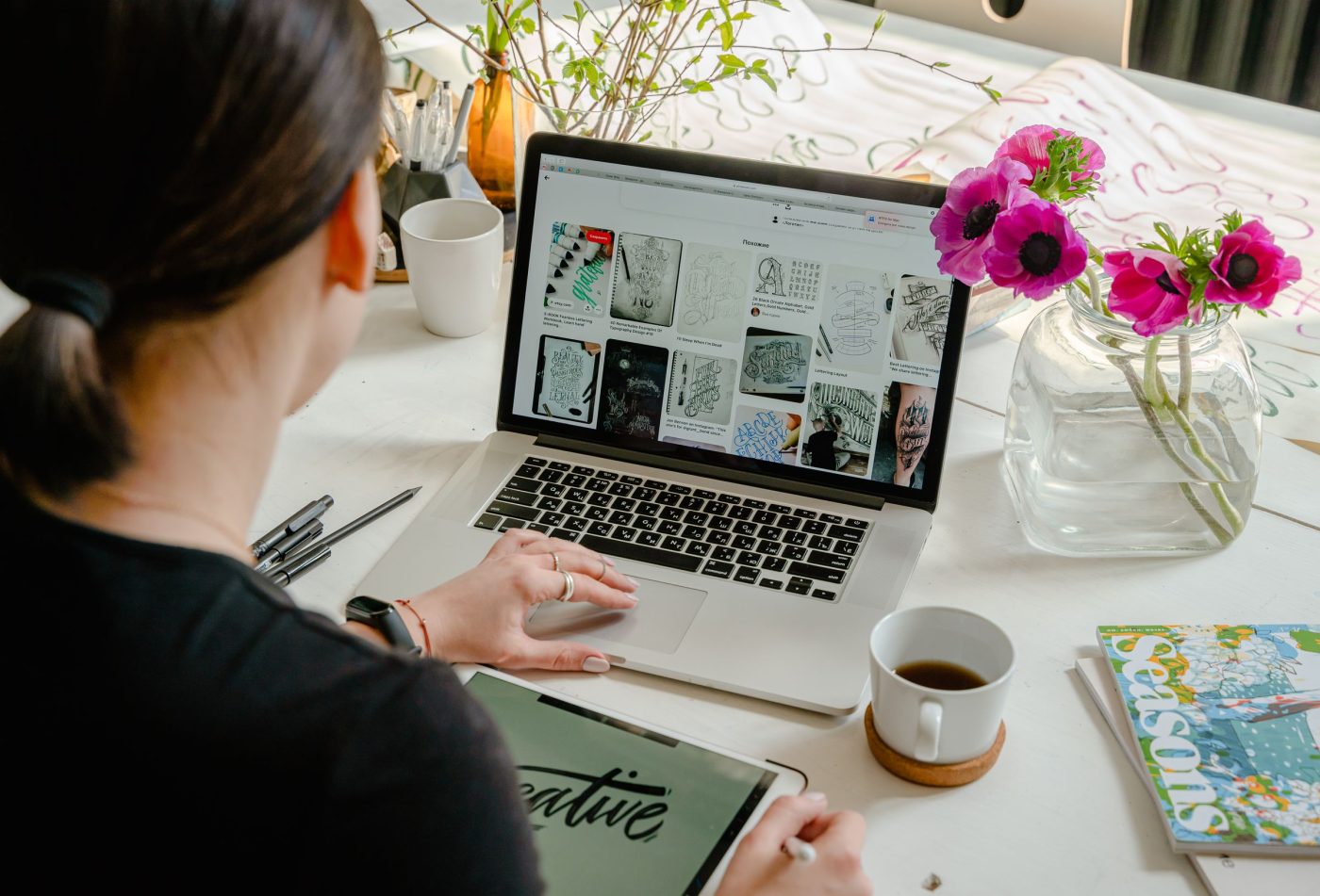 Designer working on graphic designs on a laptop