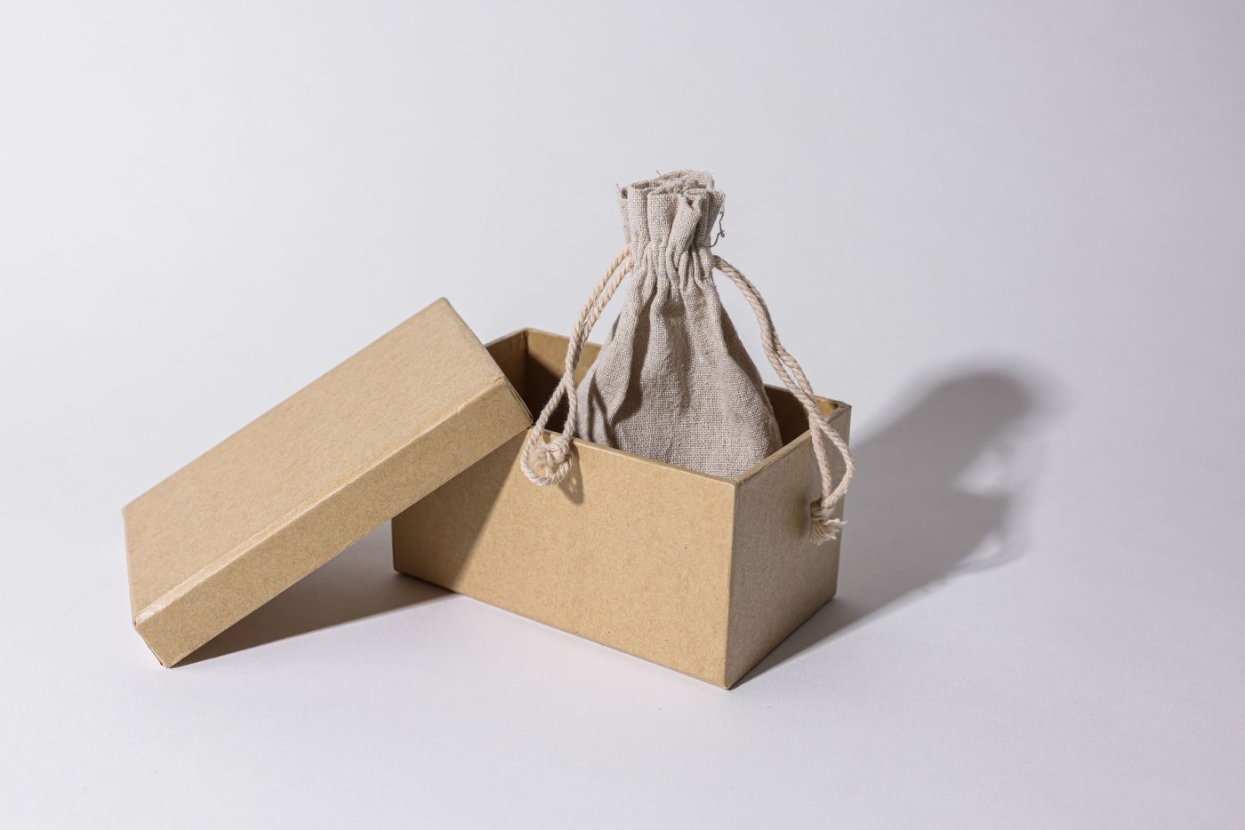 A pouch packed in a small brown branded box
